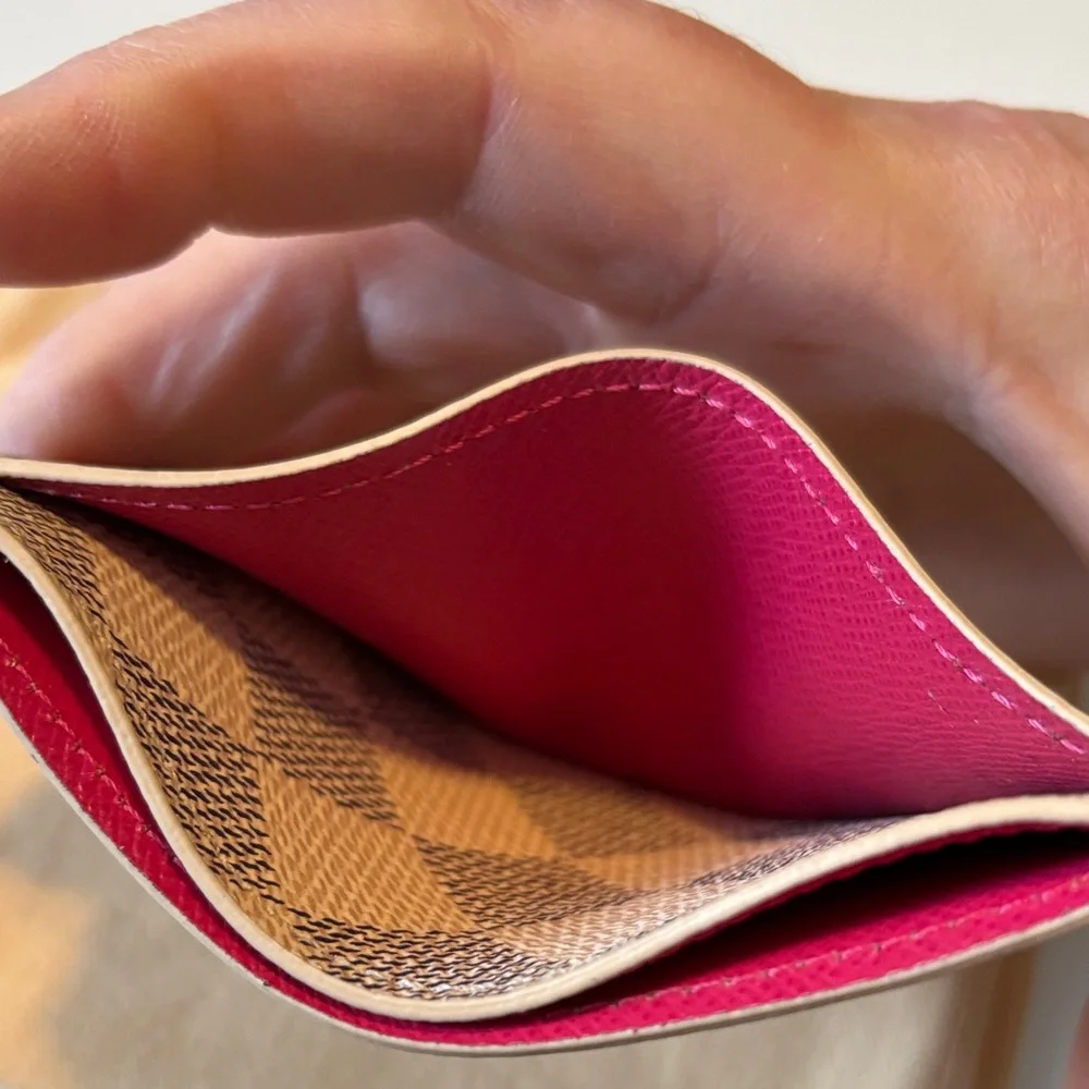 Louis Vuitton Damier Azur Studded Card Holder in the white and pink color
